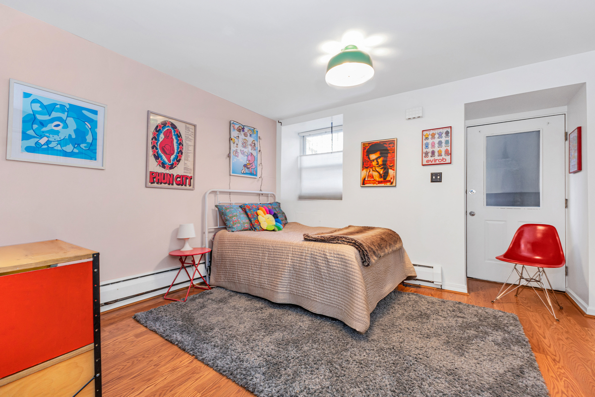 503 Clinton Street, Unit 1 Brooklyn, NY 11231 - Photo 11 of 16 a bedroom with a bed and a lamp on the table