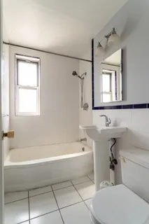 a bathroom with a sink toilet and bathtub