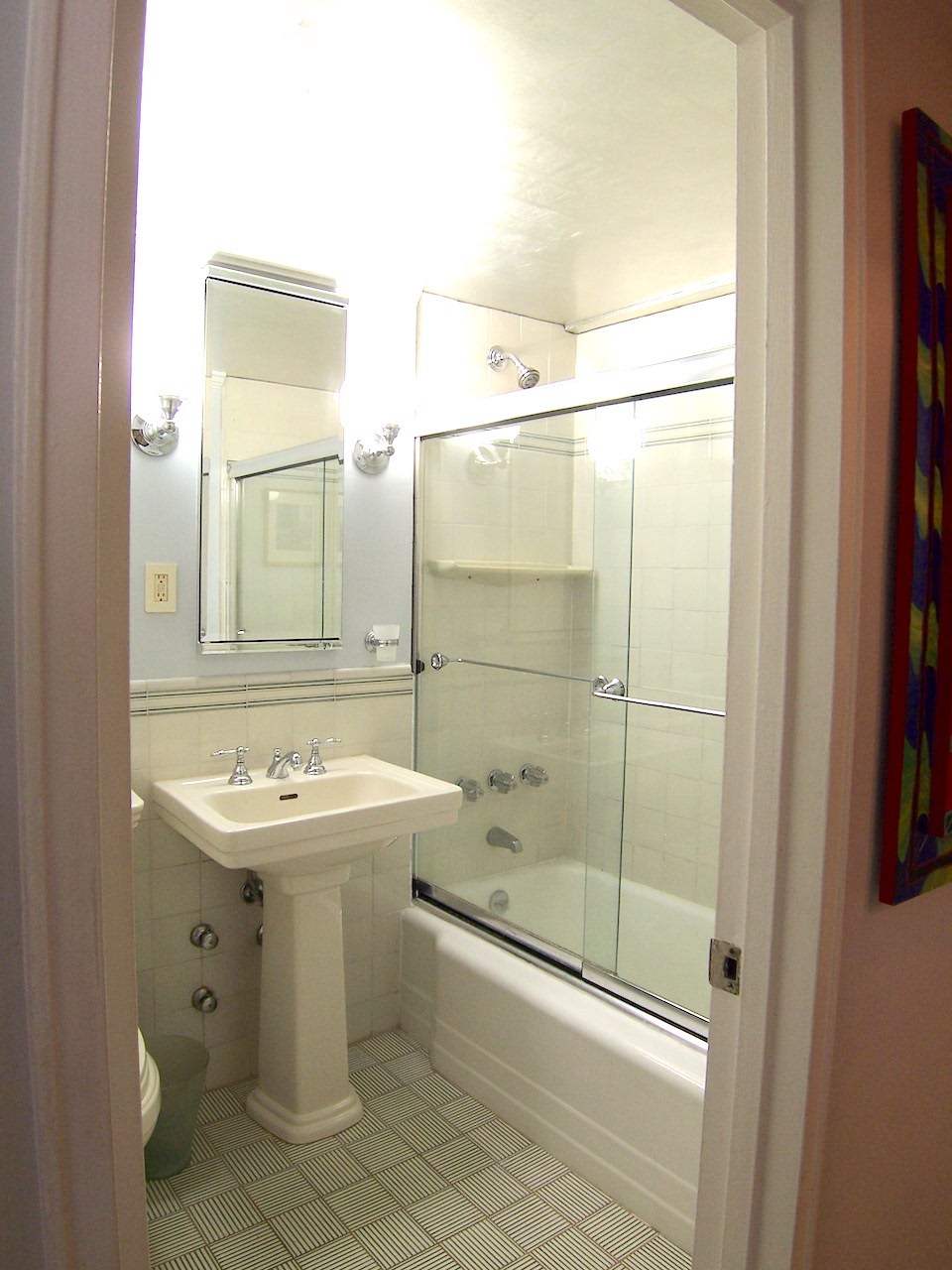 136 East 76th Street, Unit 3E Manhattan, NY 10021 - Photo 10 of 11 a bathroom with a sink mirror toilet and shower