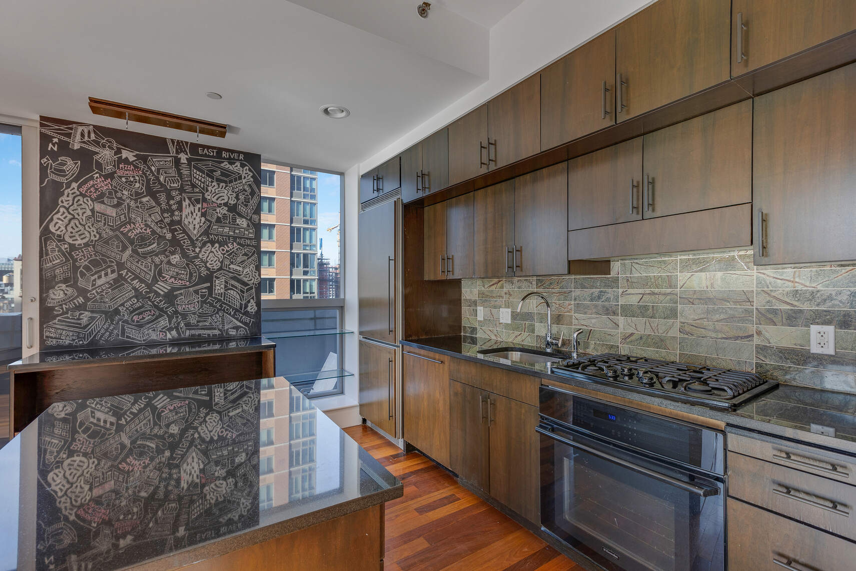 150 Myrtle Avenue, Unit 803 Brooklyn, NY 11201 - Photo 7 of 29 a kitchen with wooden cabinets and a stove top oven