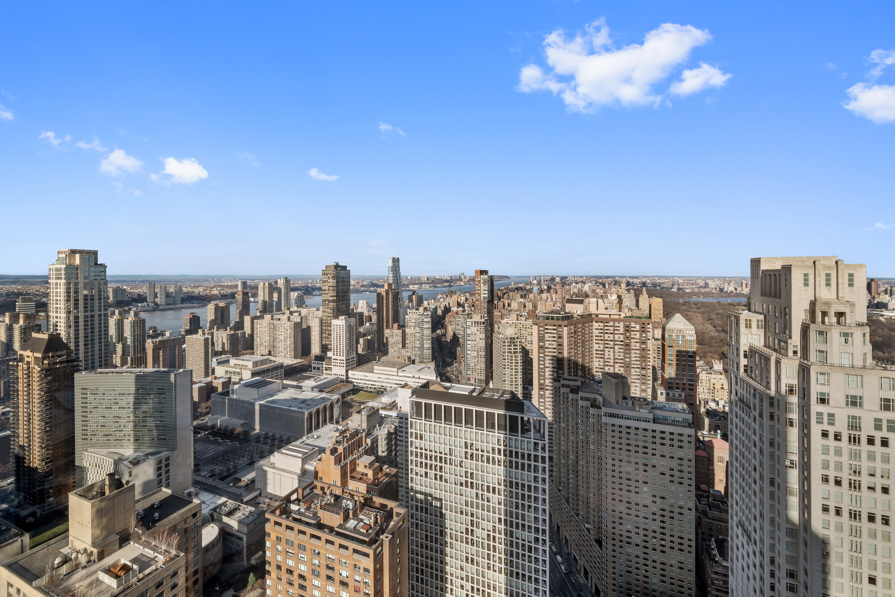 80 Columbus Circle, Unit 67B Manhattan, NY 10019 - Photo 13 of 16 a view of a city with tall buildings
