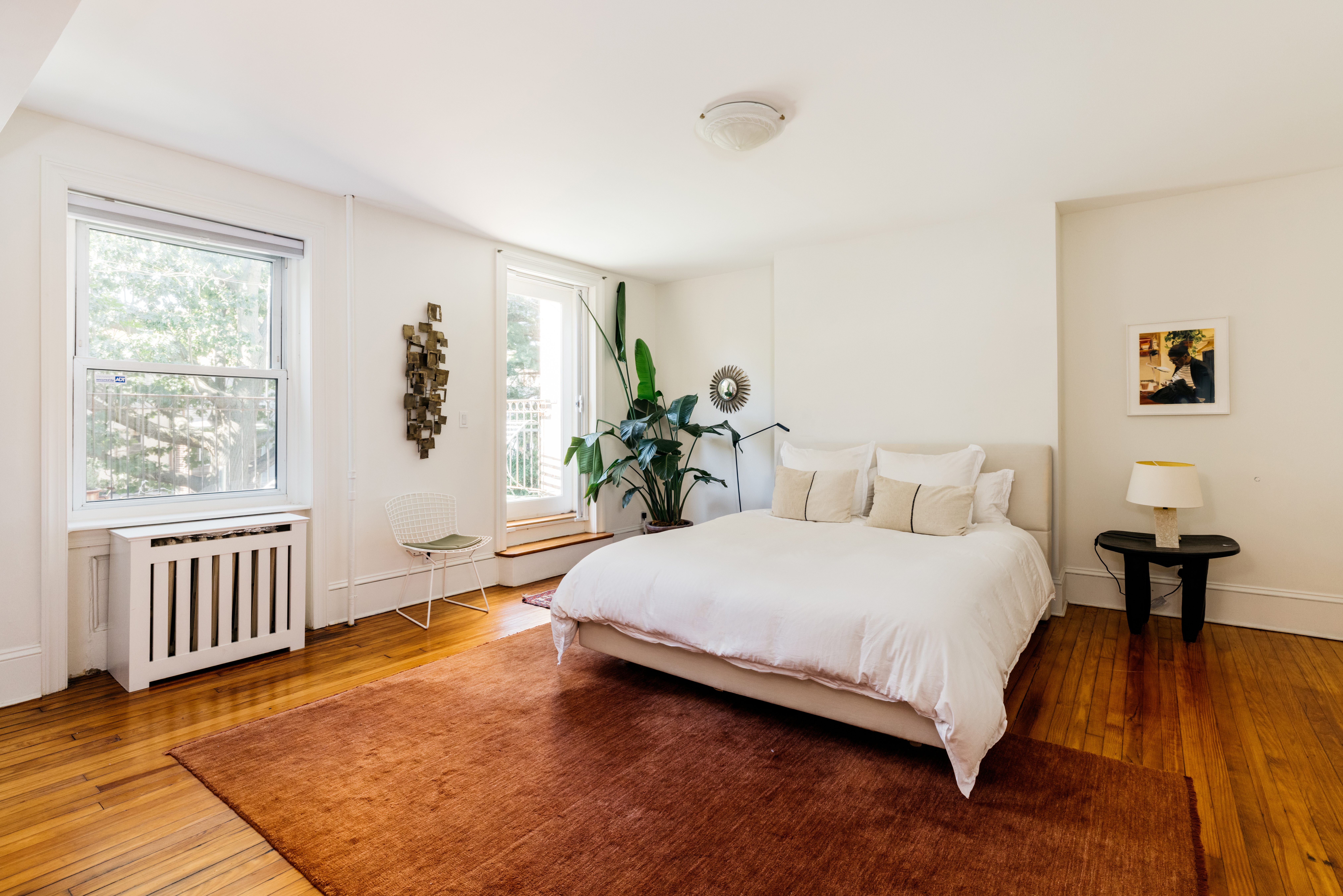 188 Warren Street, Unit TRIPLEX Brooklyn, NY 11201 - Photo 6 of 15 a bedroom with a bed and wooden floor