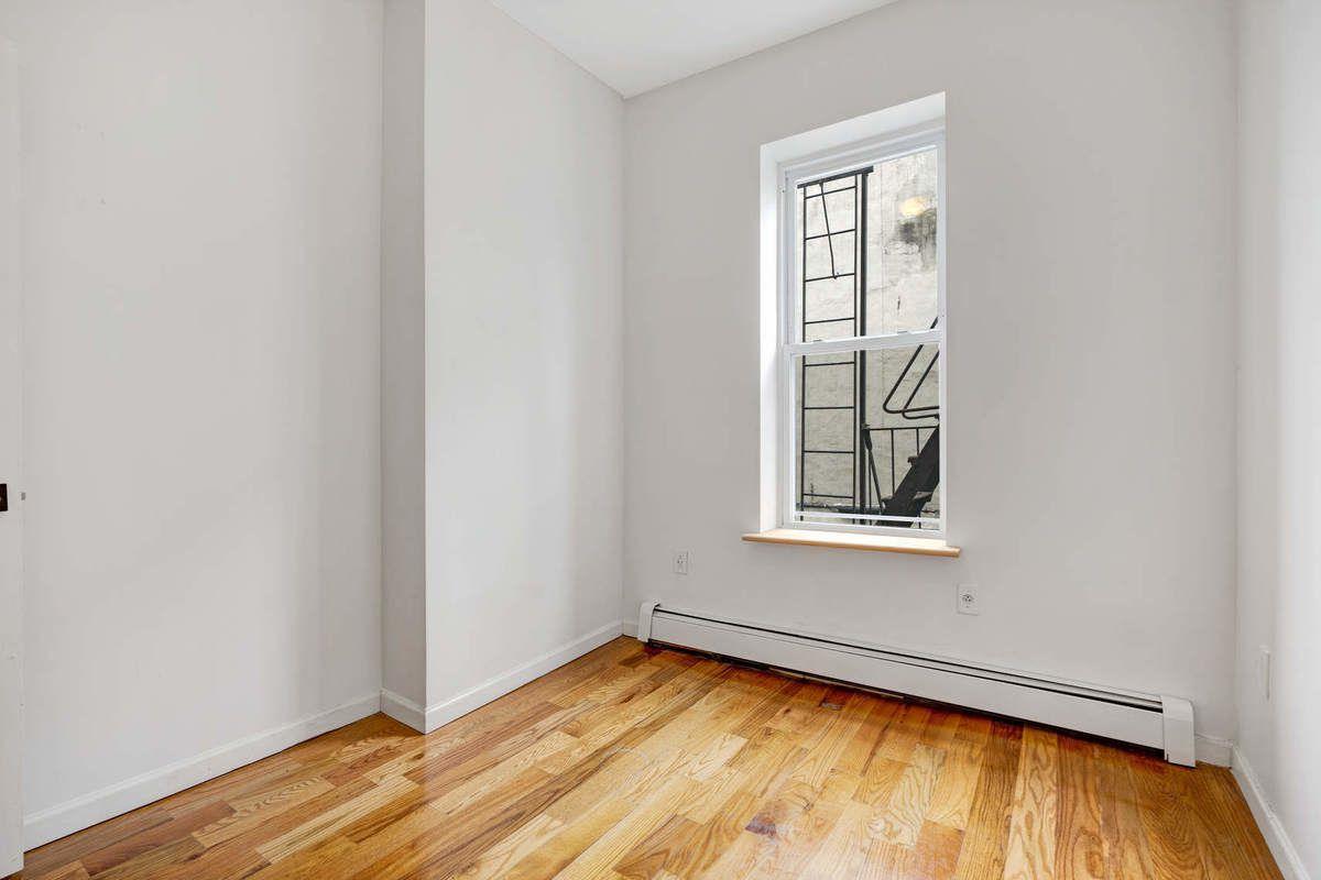 1235 Decatur Street, Unit 2 Brooklyn, NY 11207 - Photo 7 of 13 an empty room with window