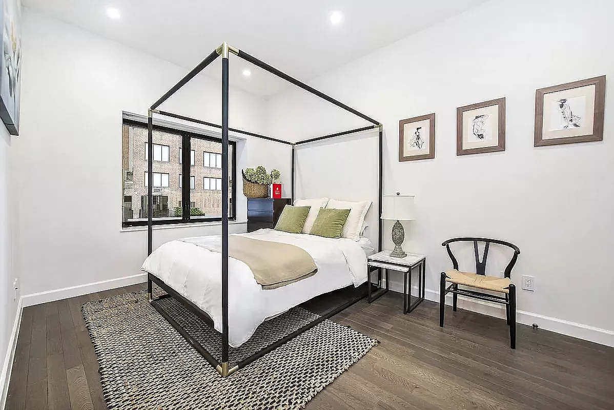 44 East End Avenue, Unit TH1 Manhattan, NY 10028 - Photo 2 of 14 a bed room with a bed and a window