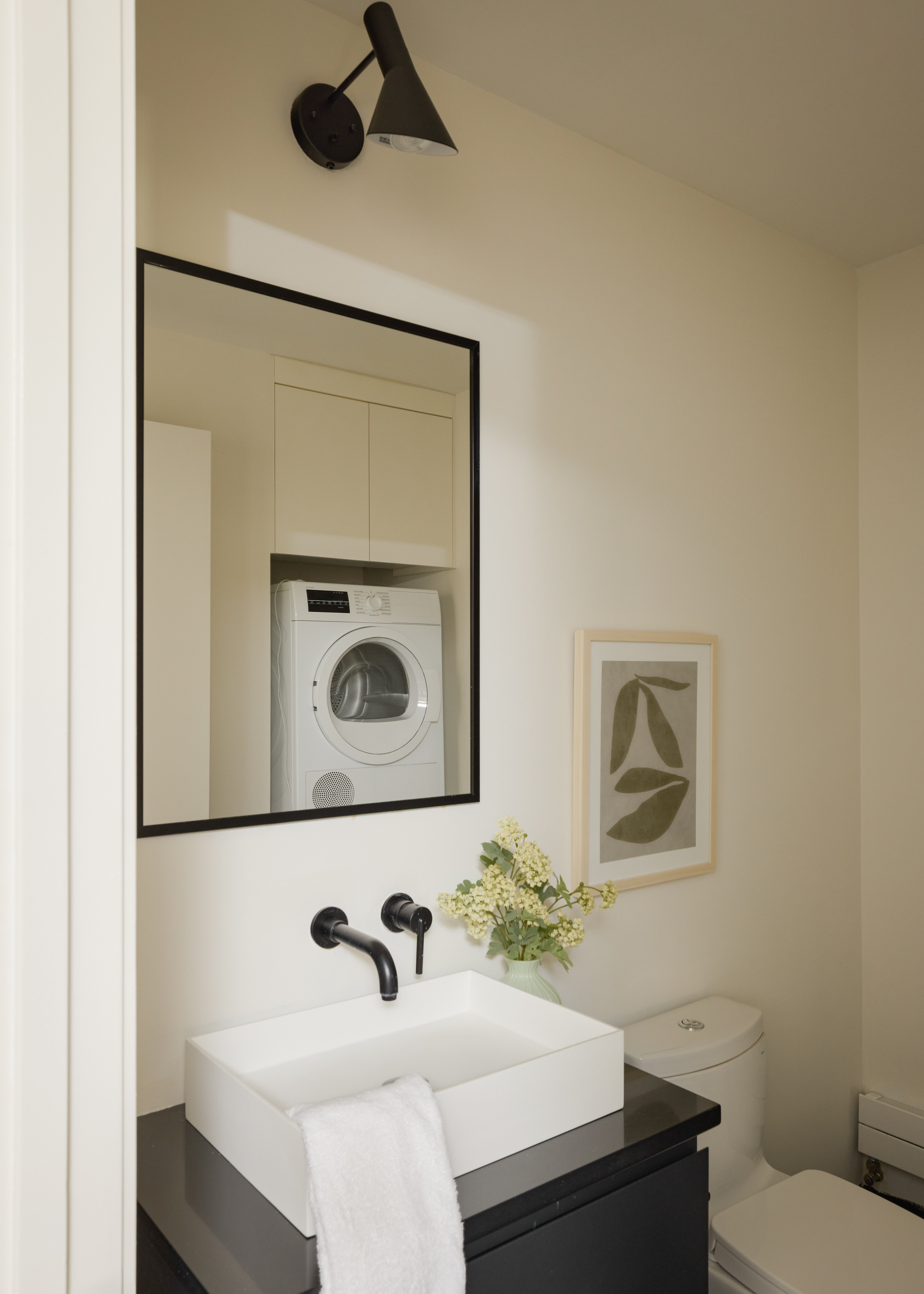 112 Hudson Street, Unit 3 Manhattan, NY 10013 - Photo 8 of 11 a bathroom with a sink and a mirror