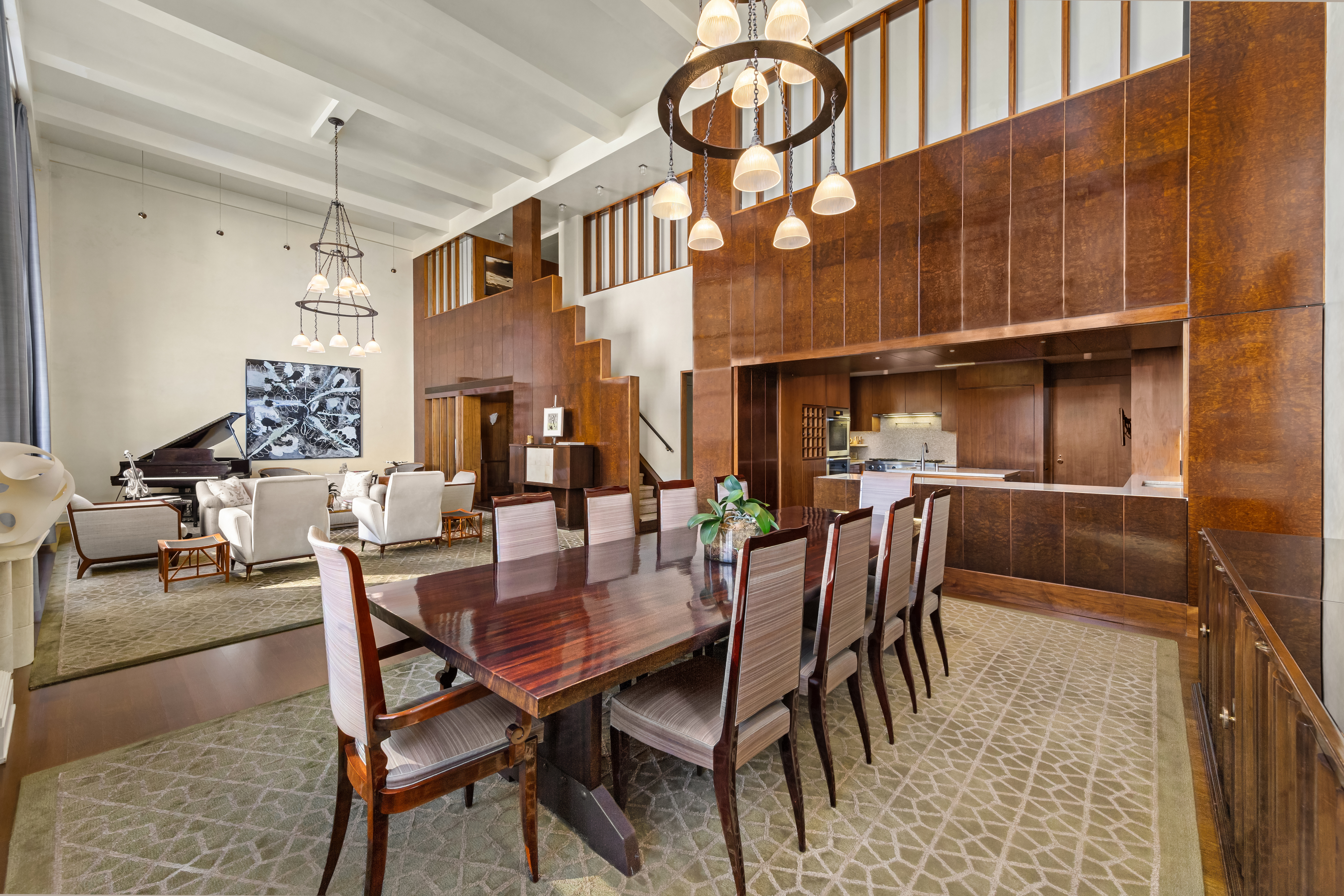 1 West 67th Street, Unit 606607 Manhattan, NY 10023 - Photo 7 of 15 a dining room with furniture and a chandelier