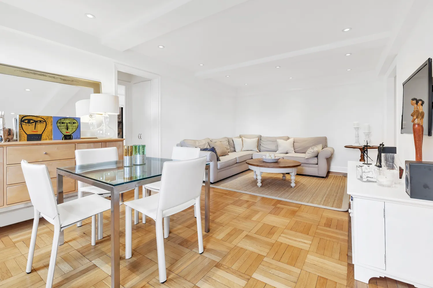 a view of a dining room with furniture and a rug