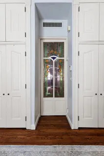 a view of front door with wooden floor