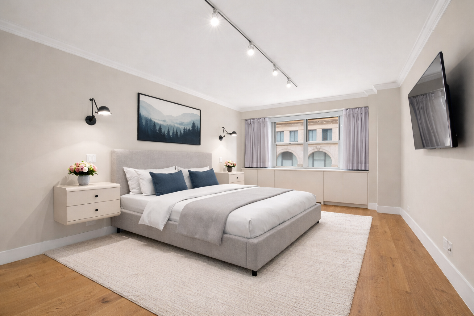 70 East 10th Street, Unit 4V Manhattan, NY 10003 - Photo 15 of 26 a bedroom with a bed and a flat screen tv