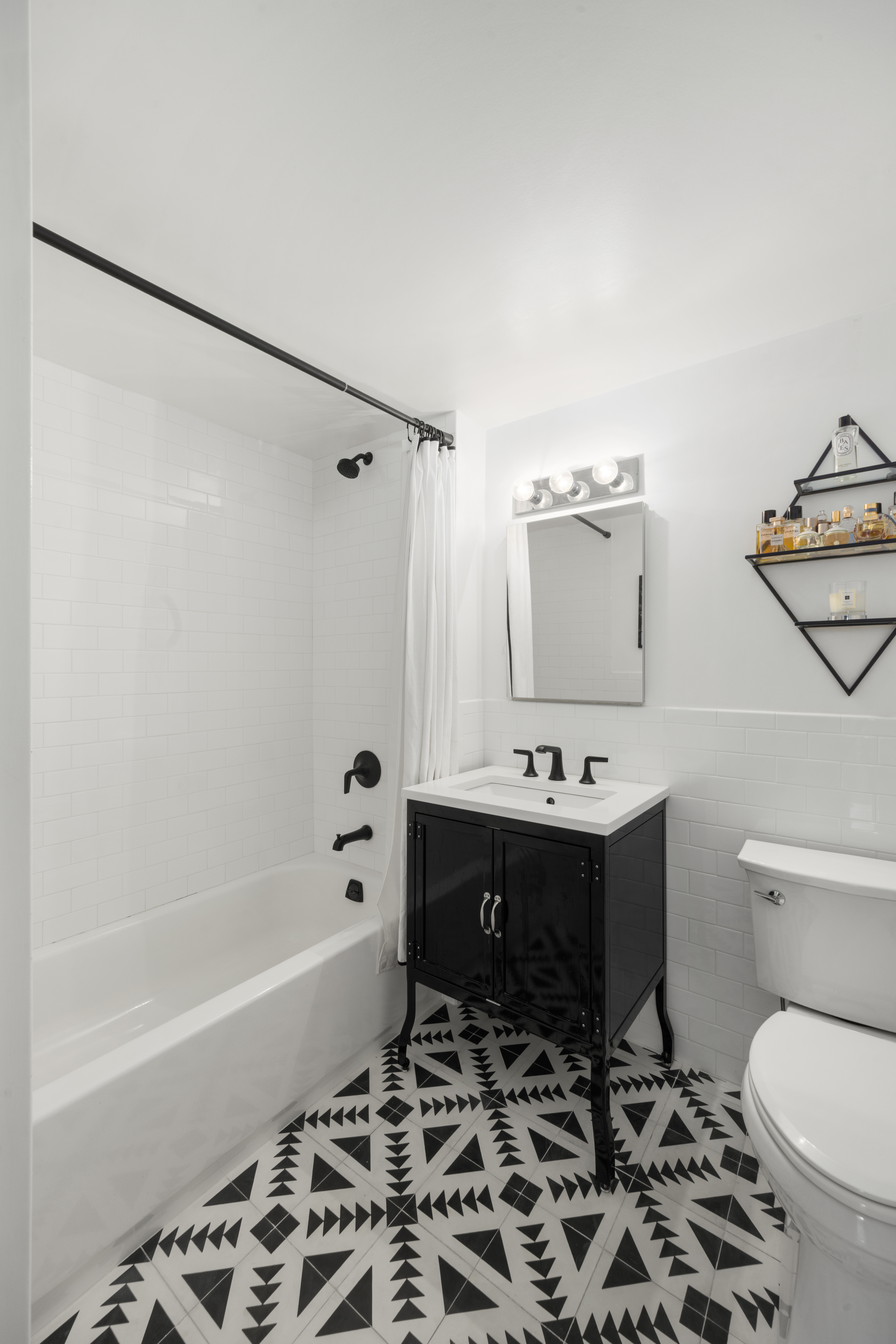 333 East 119th Street, Unit 1H Manhattan, NY 10035 - Photo 15 of 17 a bathroom with a sink toilet and shower