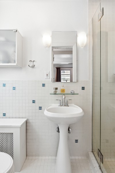 200 West 108th Street, Unit 2A Manhattan, NY 10025 - Photo 9 of 13 a bathroom with a sink toilet and shower