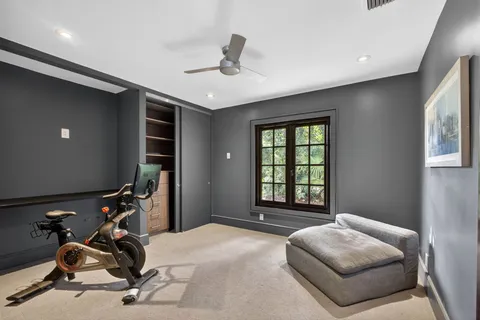 a bedroom with furniture and a window