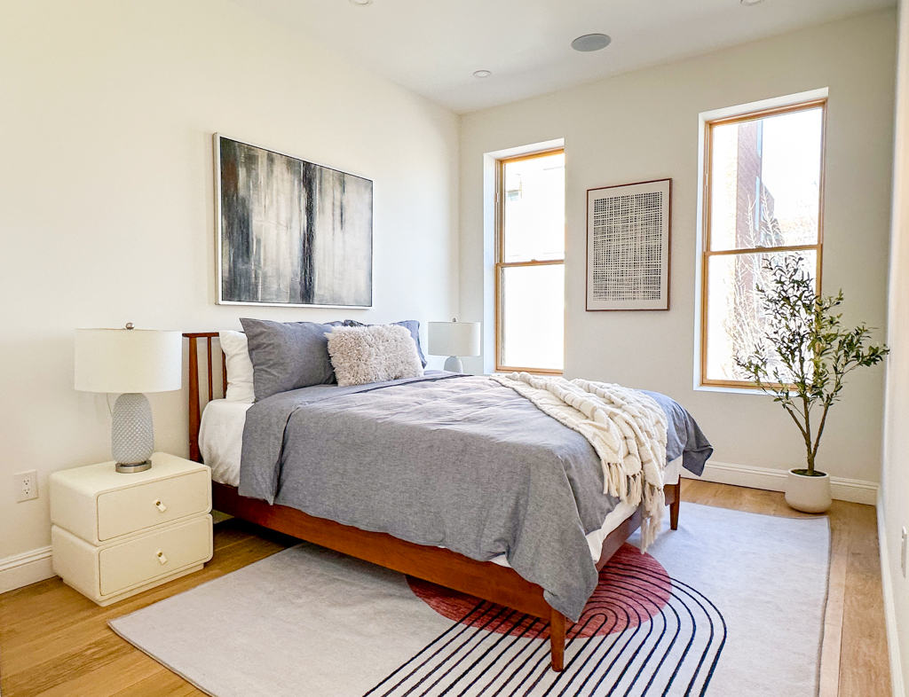 190 A Decatur Street Brooklyn, NY 11233 - Photo 10 of 17 a bedroom with a bed and a night stand