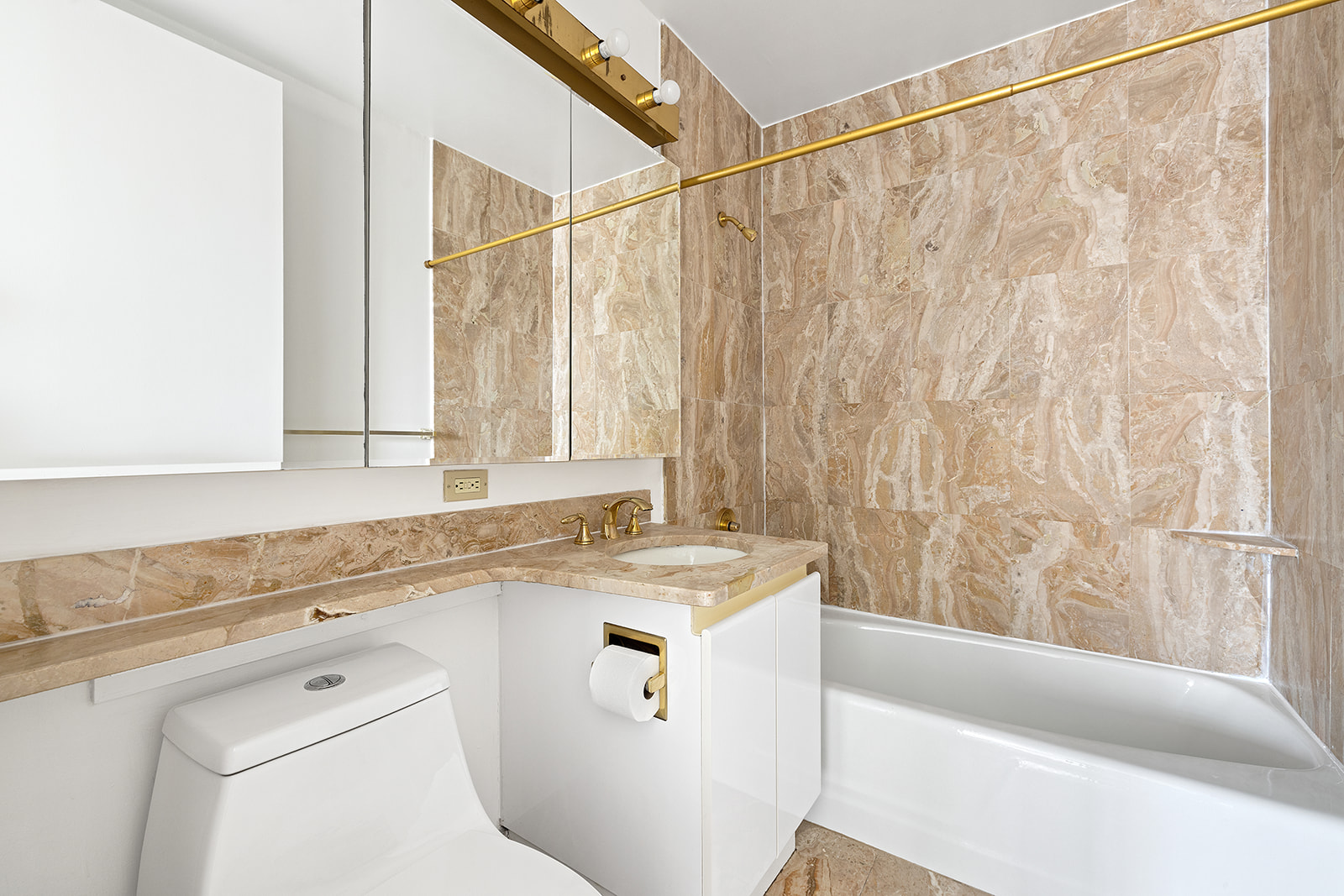 170 East 87th Street, Unit W15H Manhattan, NY 10128 - Photo 6 of 13 a bathroom with a sink and a bathtub