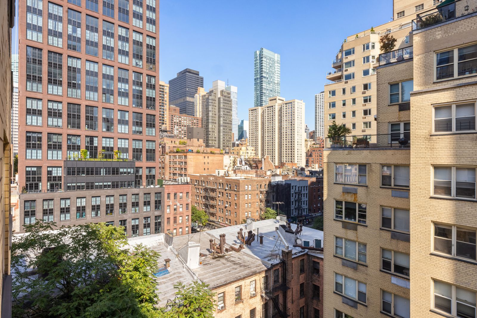 415 East 52nd Street, Unit 9AA Manhattan, NY 10022 - Photo 9 of 10 a view of a city with tall buildings