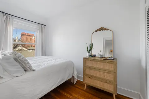 a bedroom with a bed and dresser