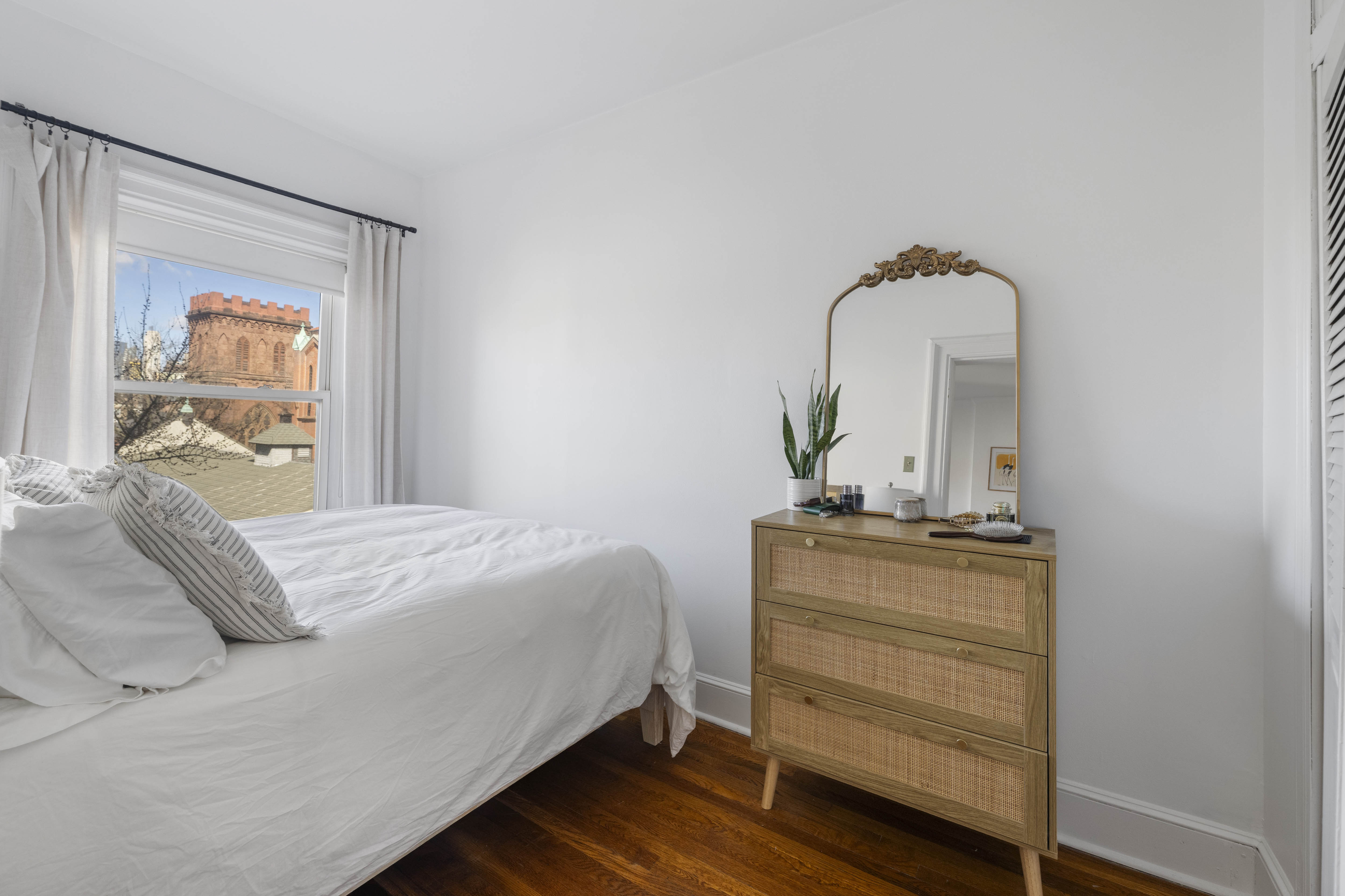 21 Monroe Place, Unit 5R Brooklyn, NY 11201 - Photo 6 of 9 a bedroom with a bed and dresser