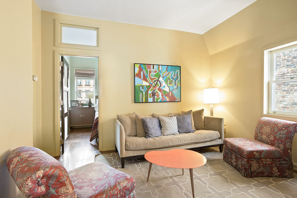315 Washington Avenue Brooklyn, NY 11205 - Photo 22 of 38 a living room with furniture and a couch