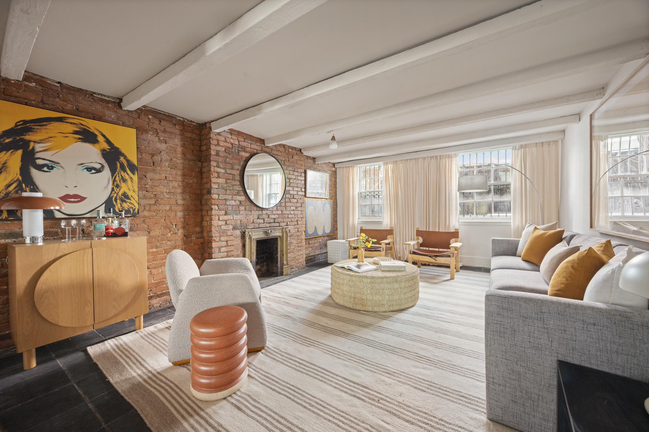 765 Greenwich Street, Unit 1 Manhattan, NY 10014 - Photo 6 of 18 a living room with fireplace furniture and a large window