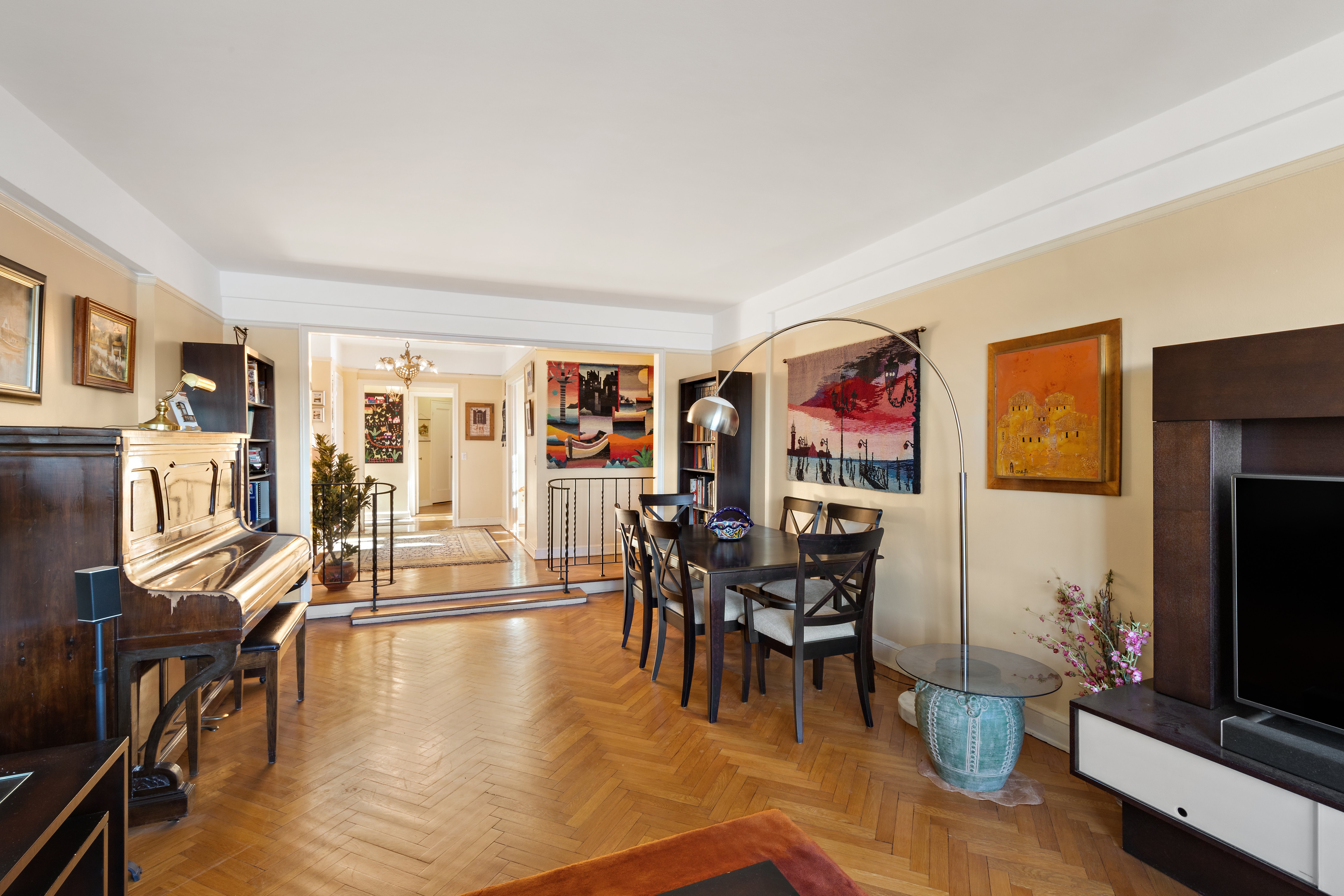 160 Cabrini Boulevard, Unit 19 Manhattan, NY 10033 - Photo 2 of 27 a living room with furniture and a flat screen tv