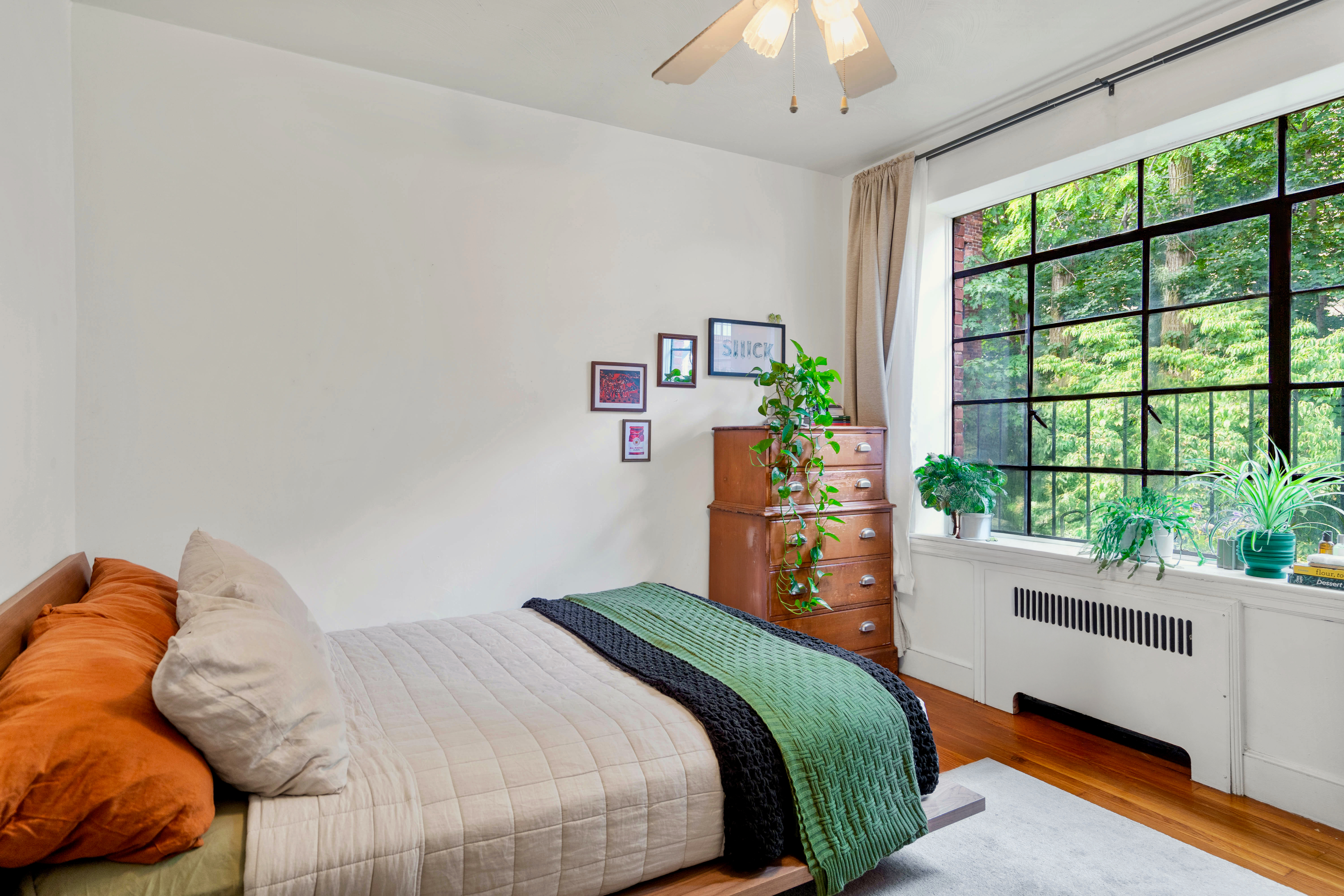 93 Strathmore Road, Unit 8 Brighton, MA 02135 - Photo 7 of 16 a bedroom with a bed and a large window