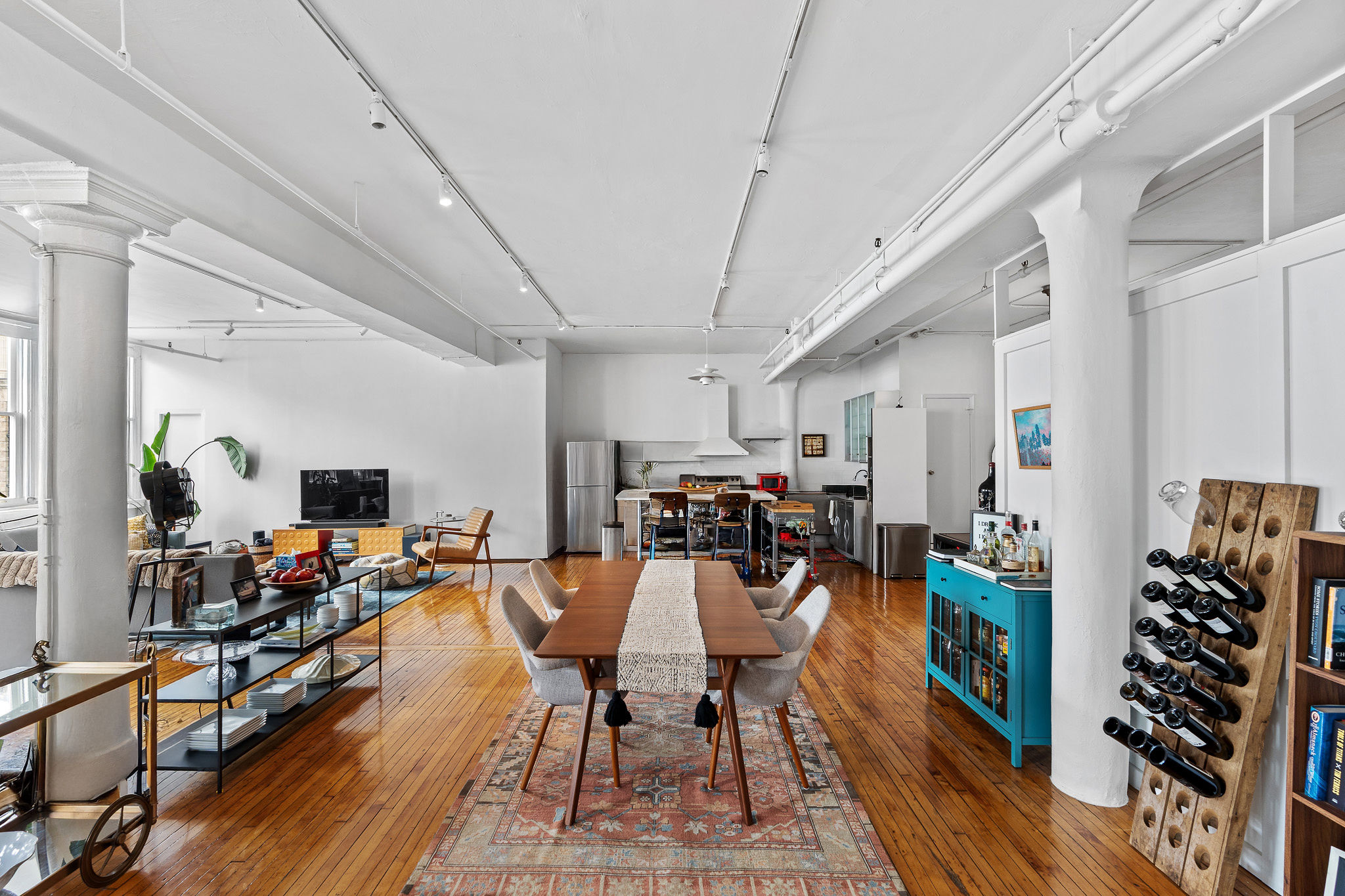 565 Broadway, Unit 8W Manhattan, NY 10012 - Photo 21 of 23 a view of a living room and dining room