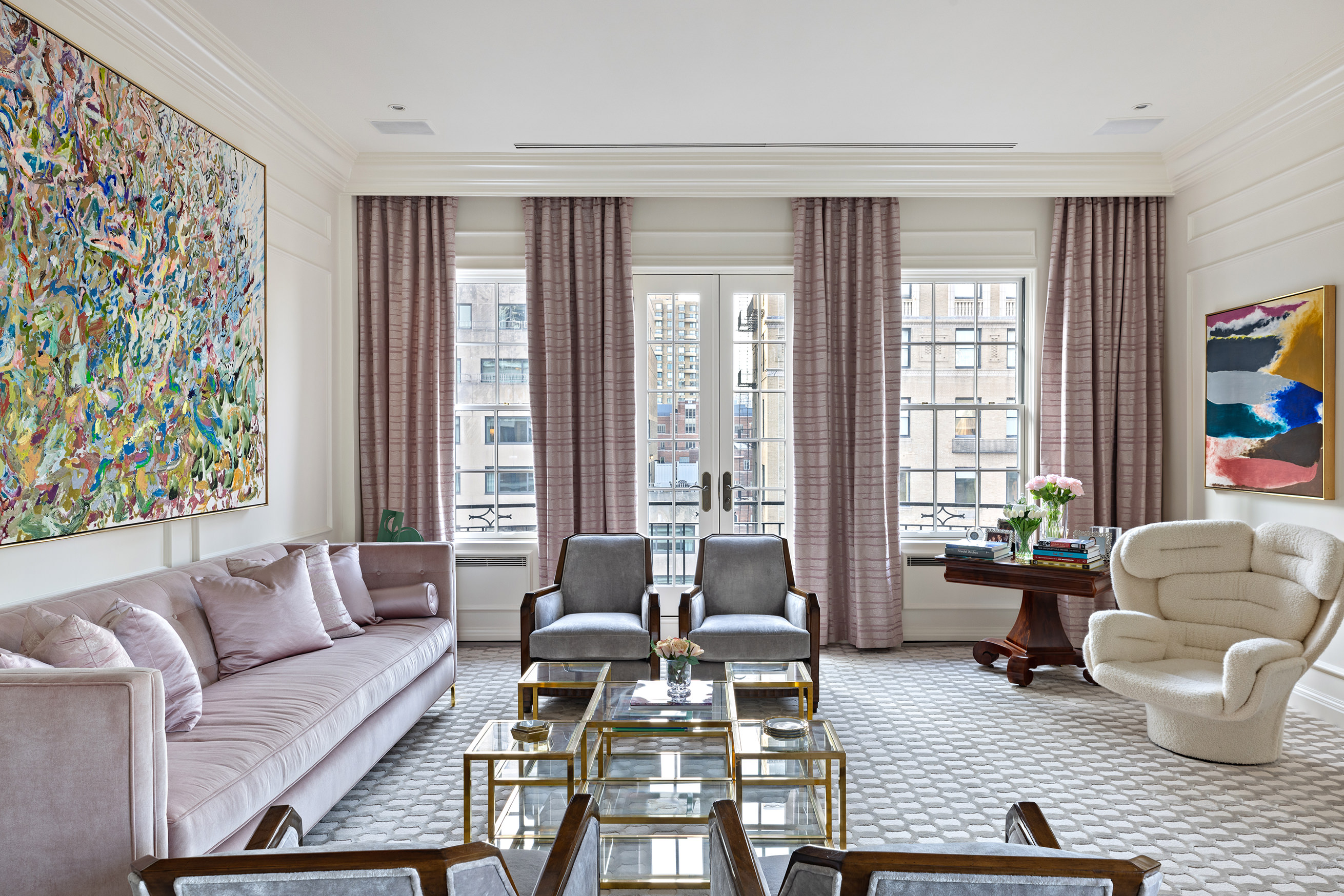 535 Park Avenue, Unit 14C Manhattan, NY 10065 - Photo 5 of 18 a living room with furniture and a large window