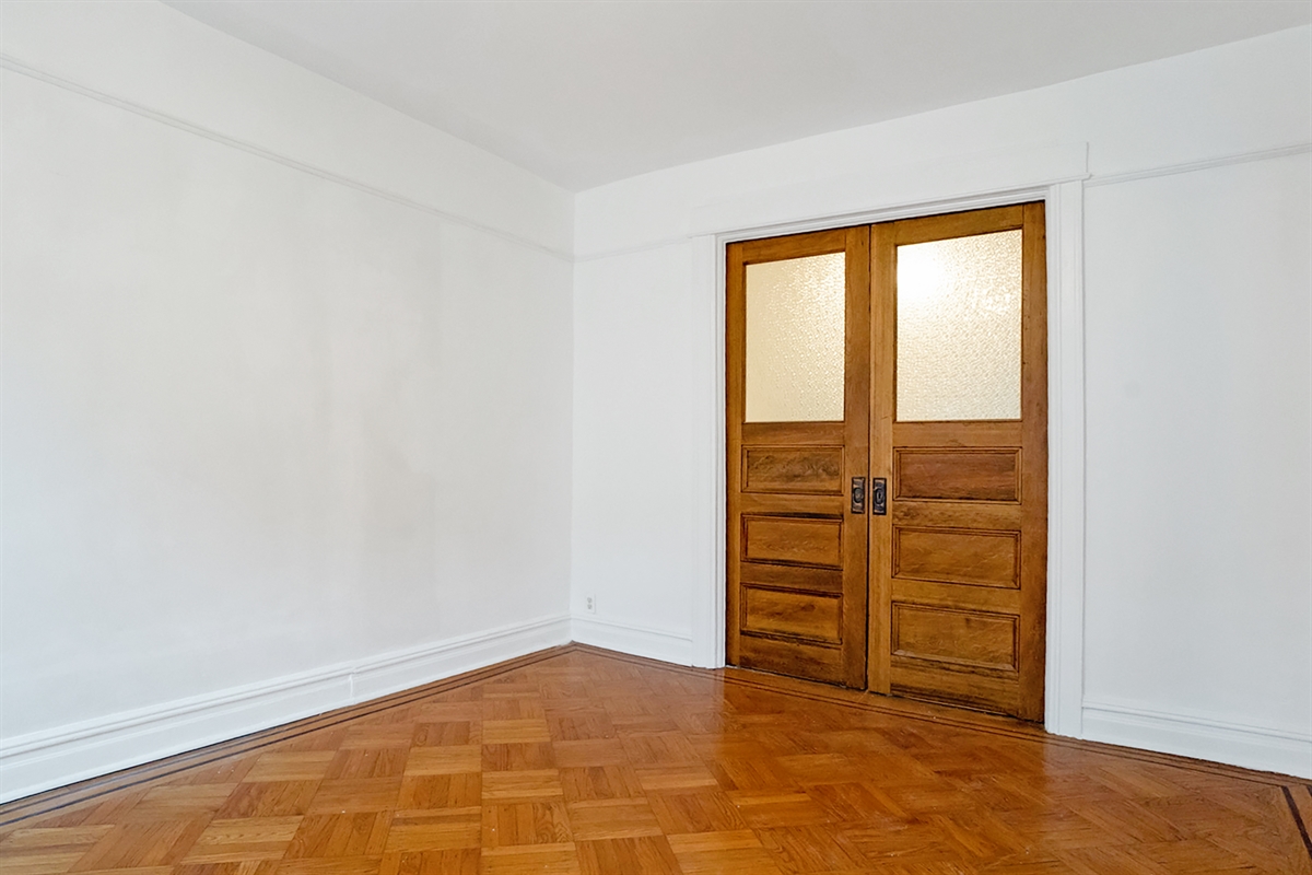 829 Caton Avenue, Unit 2 Brooklyn, NY 11218 - Photo 2 of 3 an empty room with window