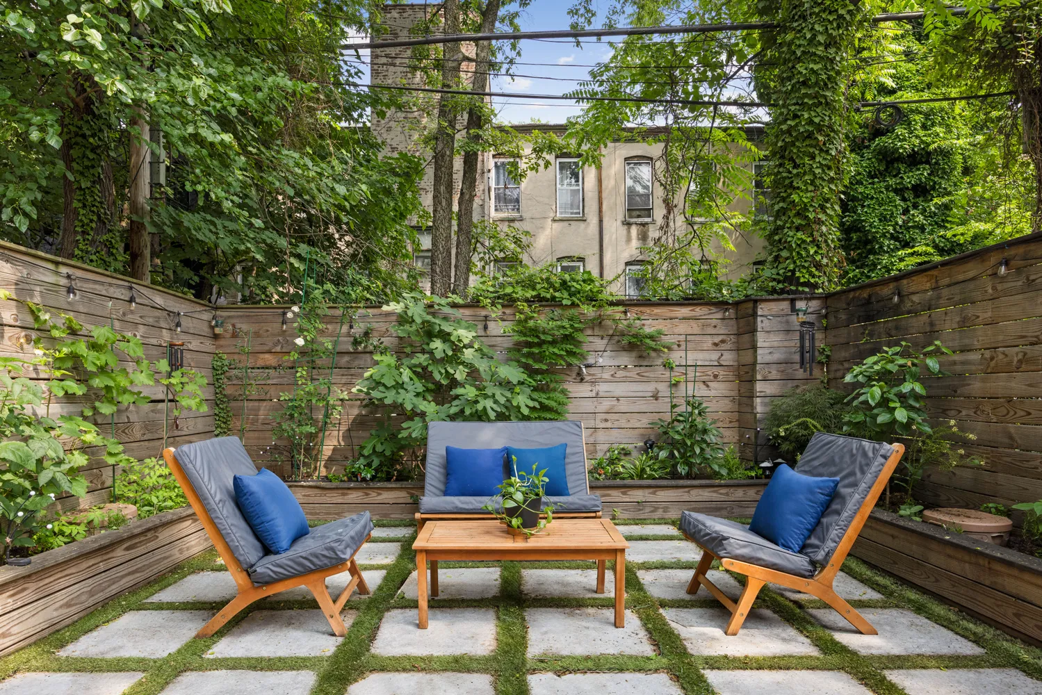 a view of a patio with couple of chairs