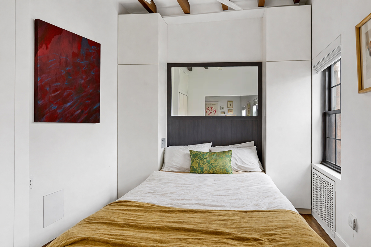 56 Jane Street, Unit 4B Manhattan, NY 10014 - Photo 2 of 5 a bedroom with a bed and a painting on the wall