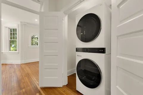 a view of a hallway with washer and dryer