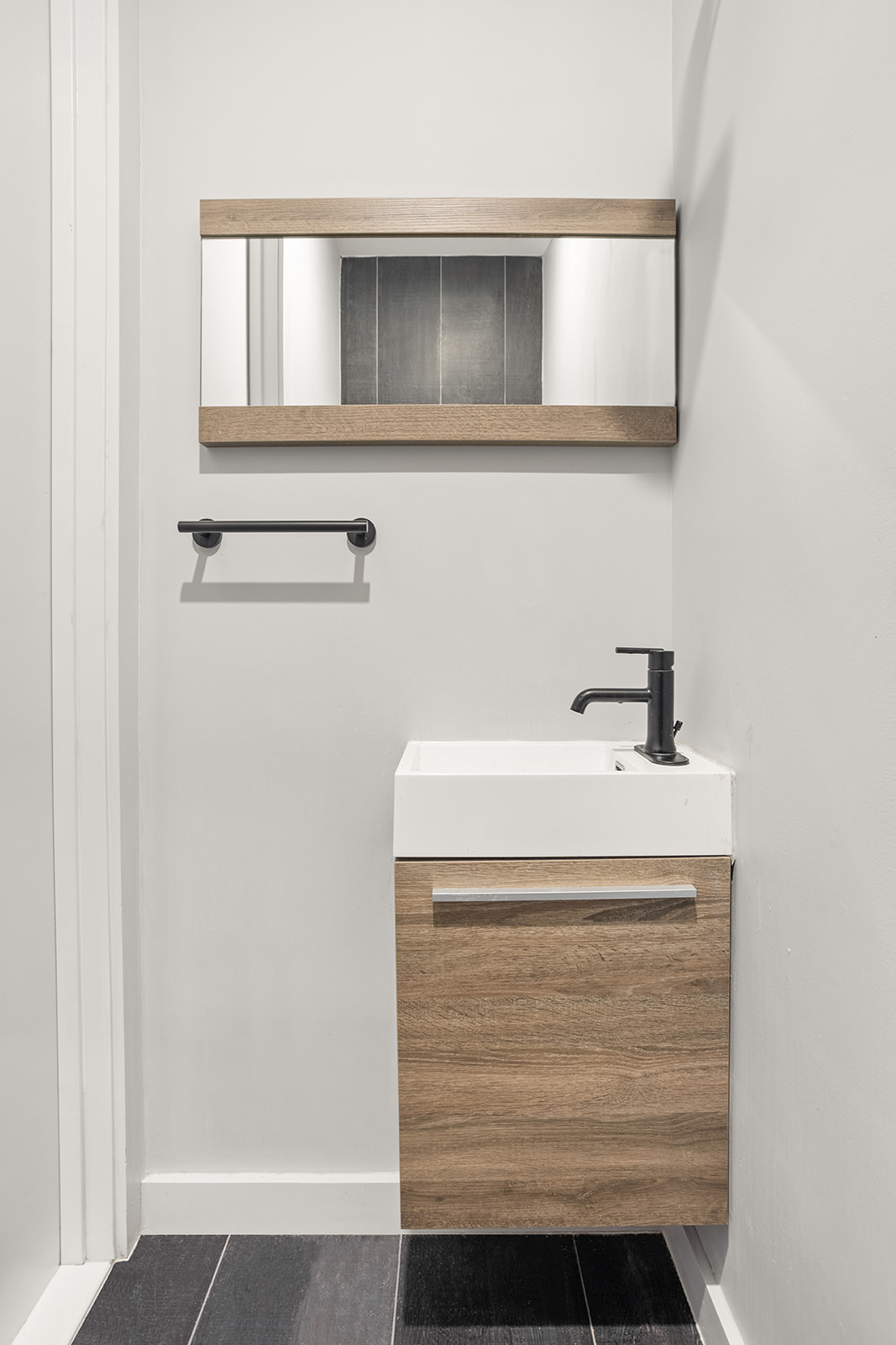 64 Stanhope Street, Unit 2A Brooklyn, NY 11221 - Photo 7 of 9 a bathroom with a sink and mirror