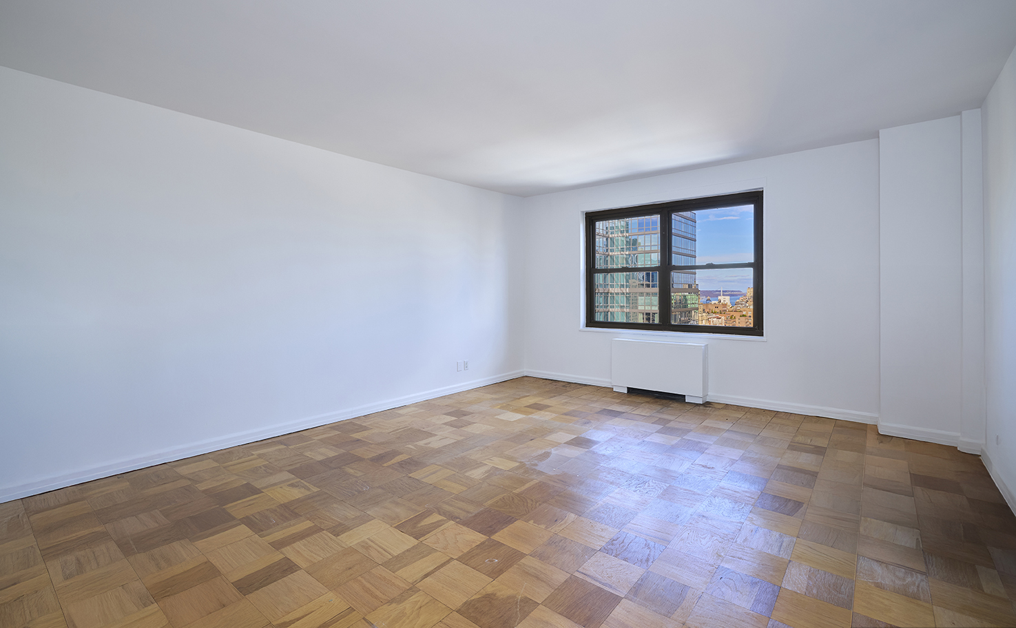 180 West End Avenue, Unit 27A Manhattan, NY 10023 - Photo 10 of 18 an empty room with windows