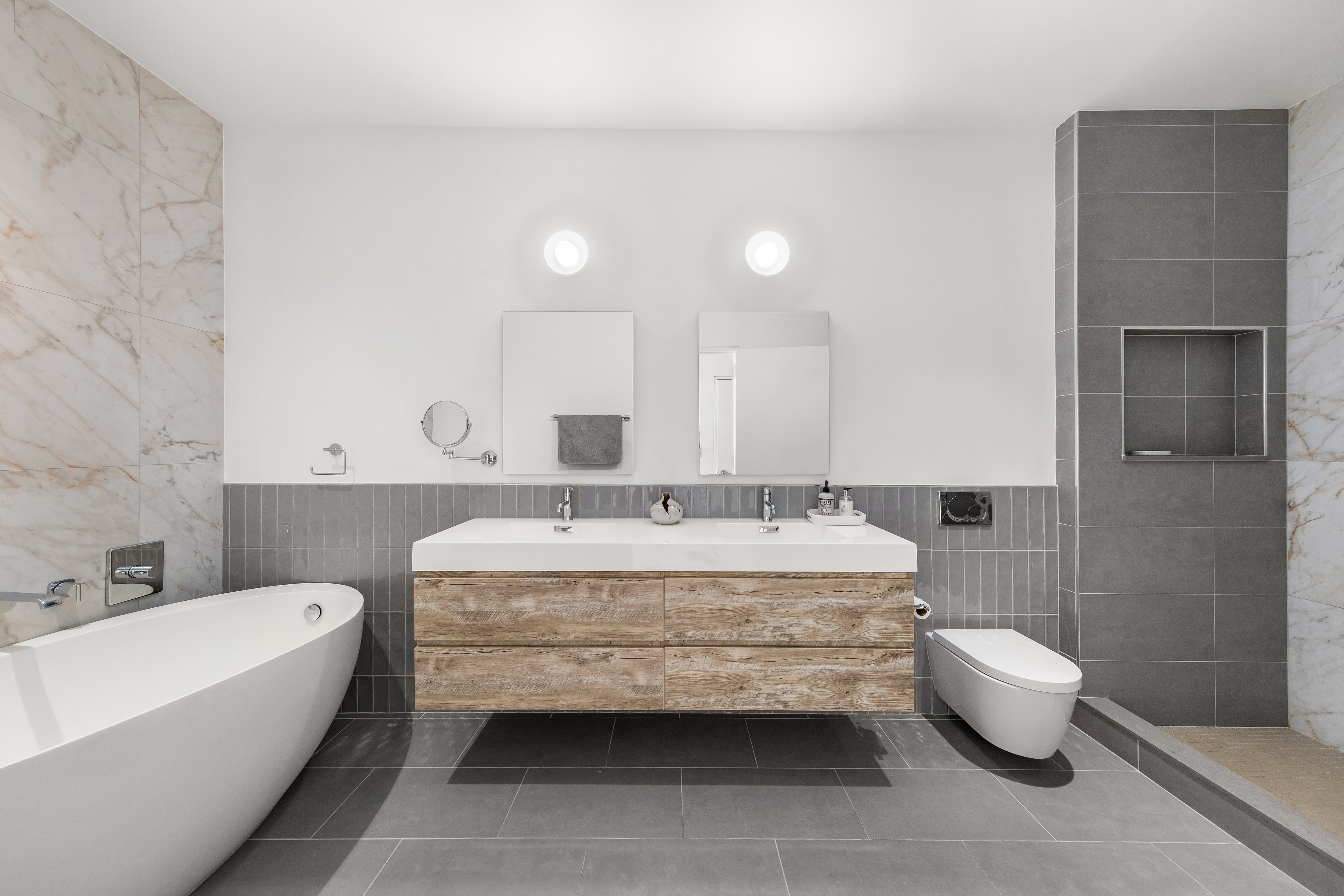 60 West 20th Street, Unit 4E Manhattan, NY 10011 - Photo 9 of 16 a bathroom with a tub sink and toilet