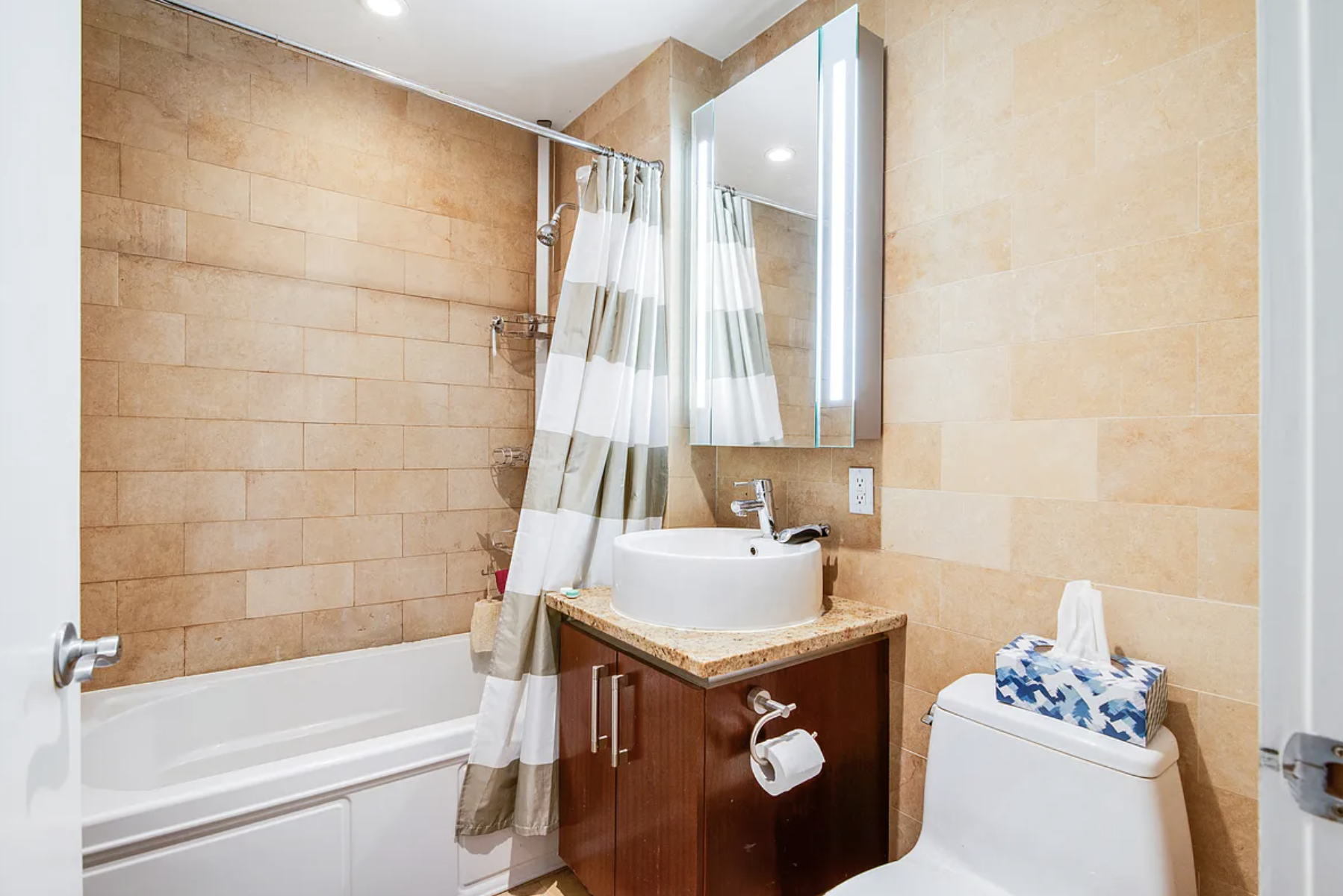 41-26 27th Street, Unit 4B Queens, NY 11101 - Photo 4 of 10 a bathroom with a tub sink and toilet