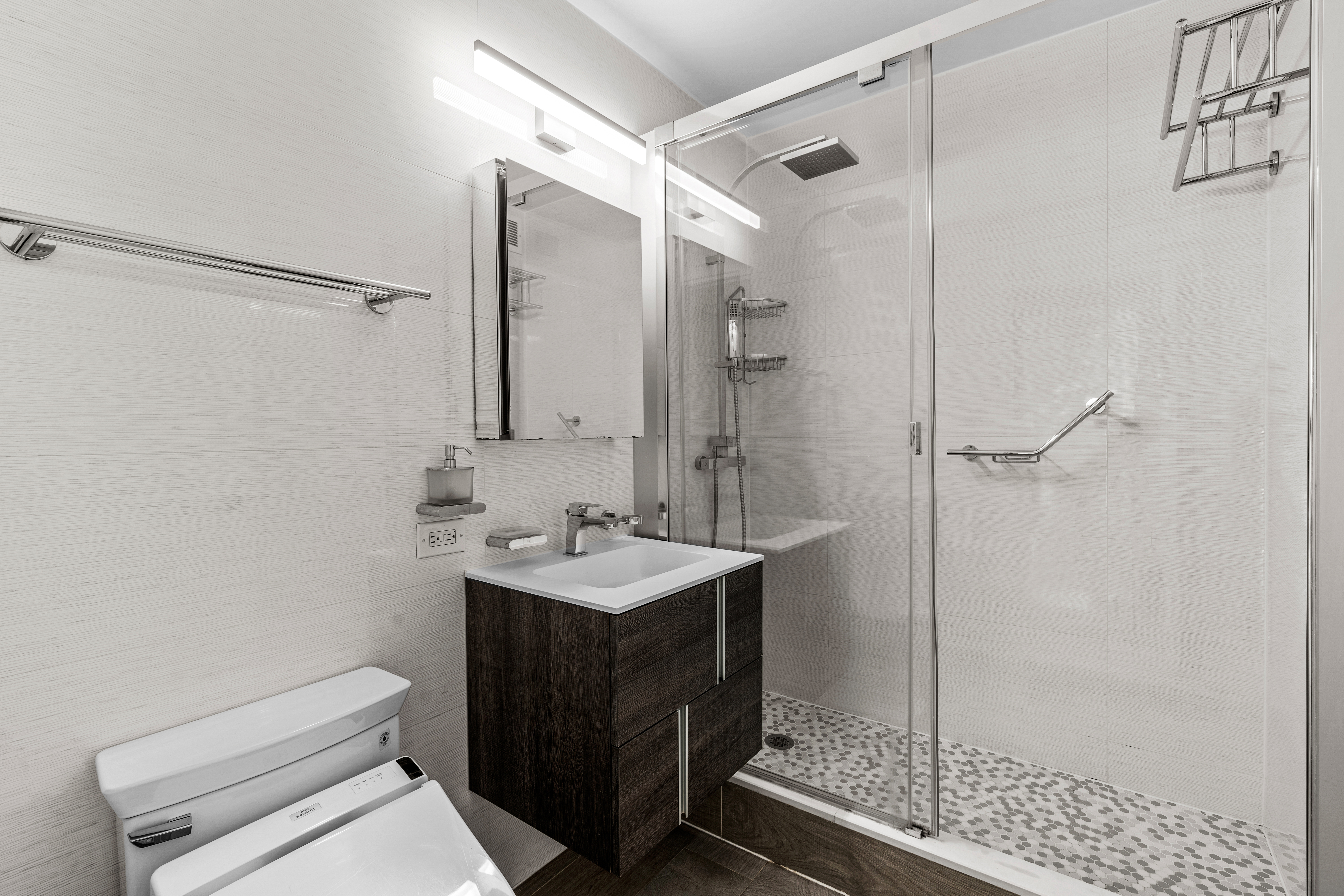 112-01 Queens Boulevard, Unit 7E Queens, NY 11375 - Photo 6 of 27 a bathroom with a sink toilet and shower