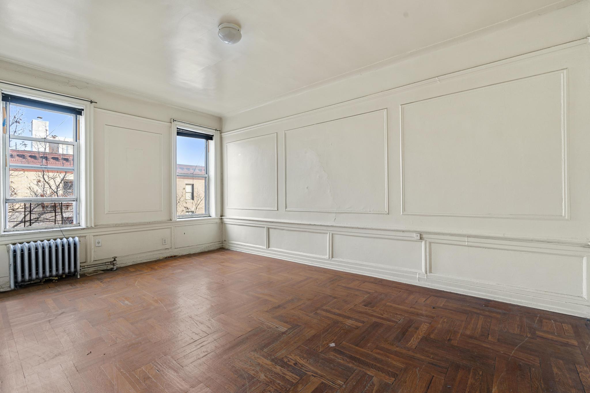 88 Brooklyn Avenue, Unit D5 Brooklyn, NY 11216 - Photo 4 of 8 an empty room with cabinet