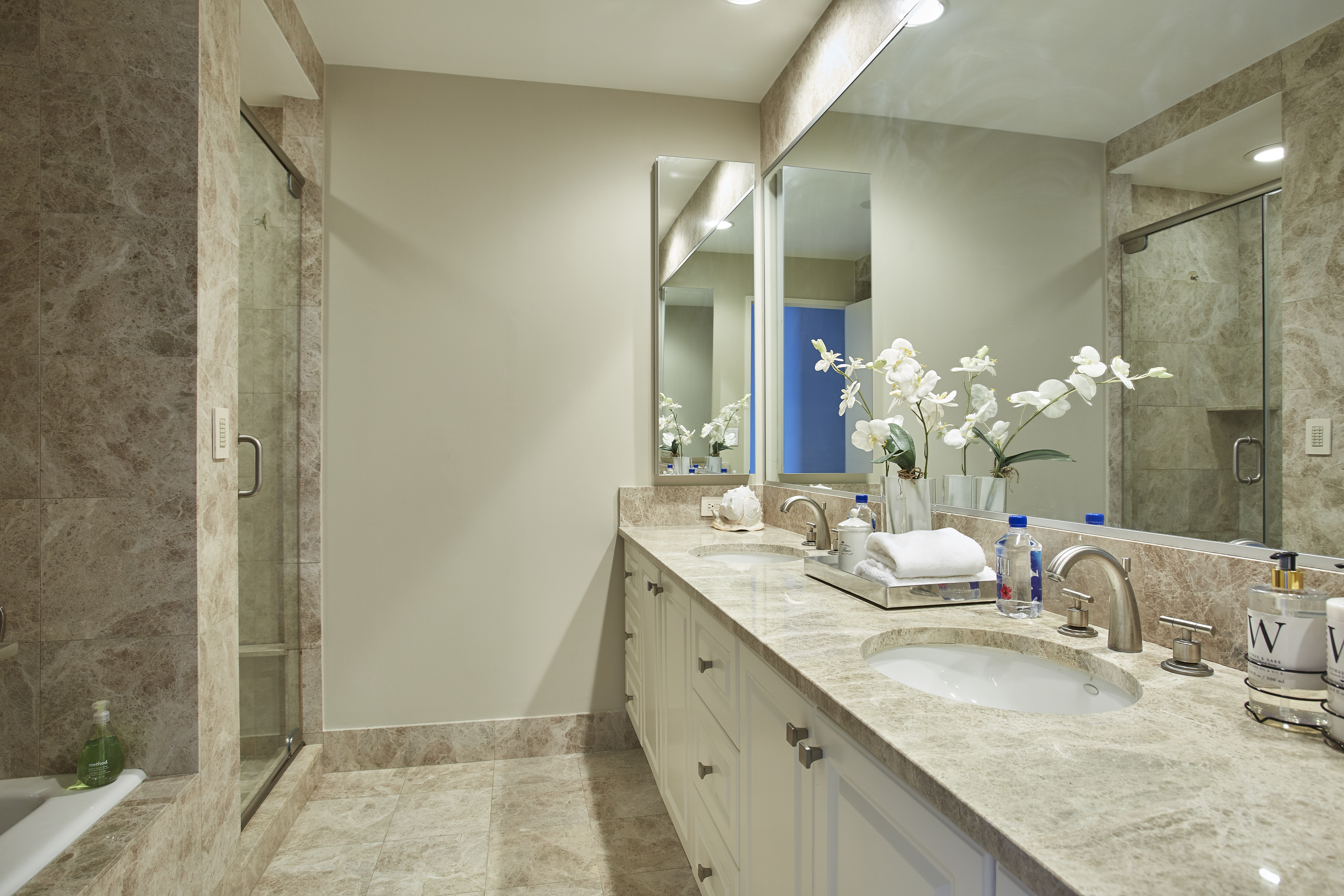 220 Riverside Boulevard, Unit 19JG Manhattan, NY 10069 - Photo 6 of 13 a bathroom with a granite countertop double vanity sink and a mirror