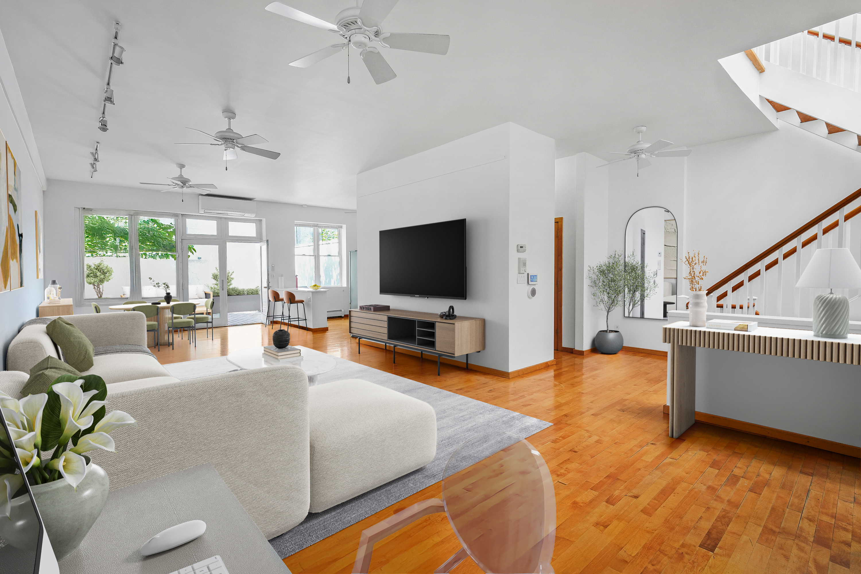 a living room with furniture and a flat screen tv