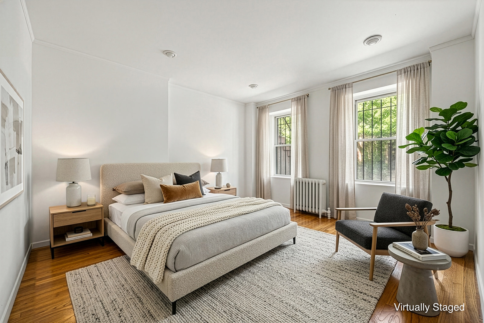 726A Union Street, Unit 1 Brooklyn, NY 11215 - Photo 3 of 13 a bedroom with a bed a couch and a potted plant