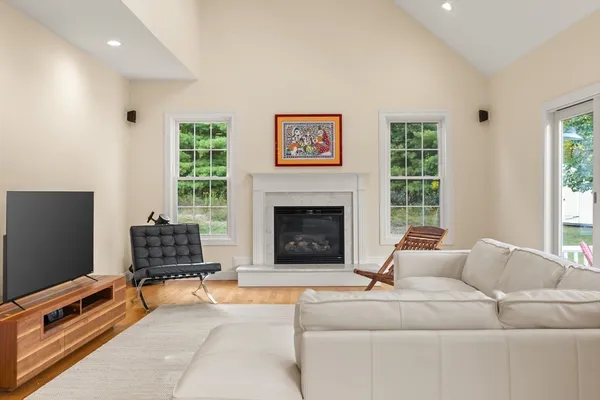 a living room with furniture and a fireplace
