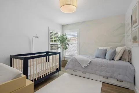 a bedroom with a bed and a window