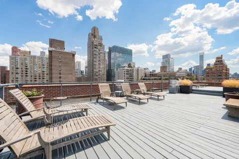 a view of a terrace with sitting area