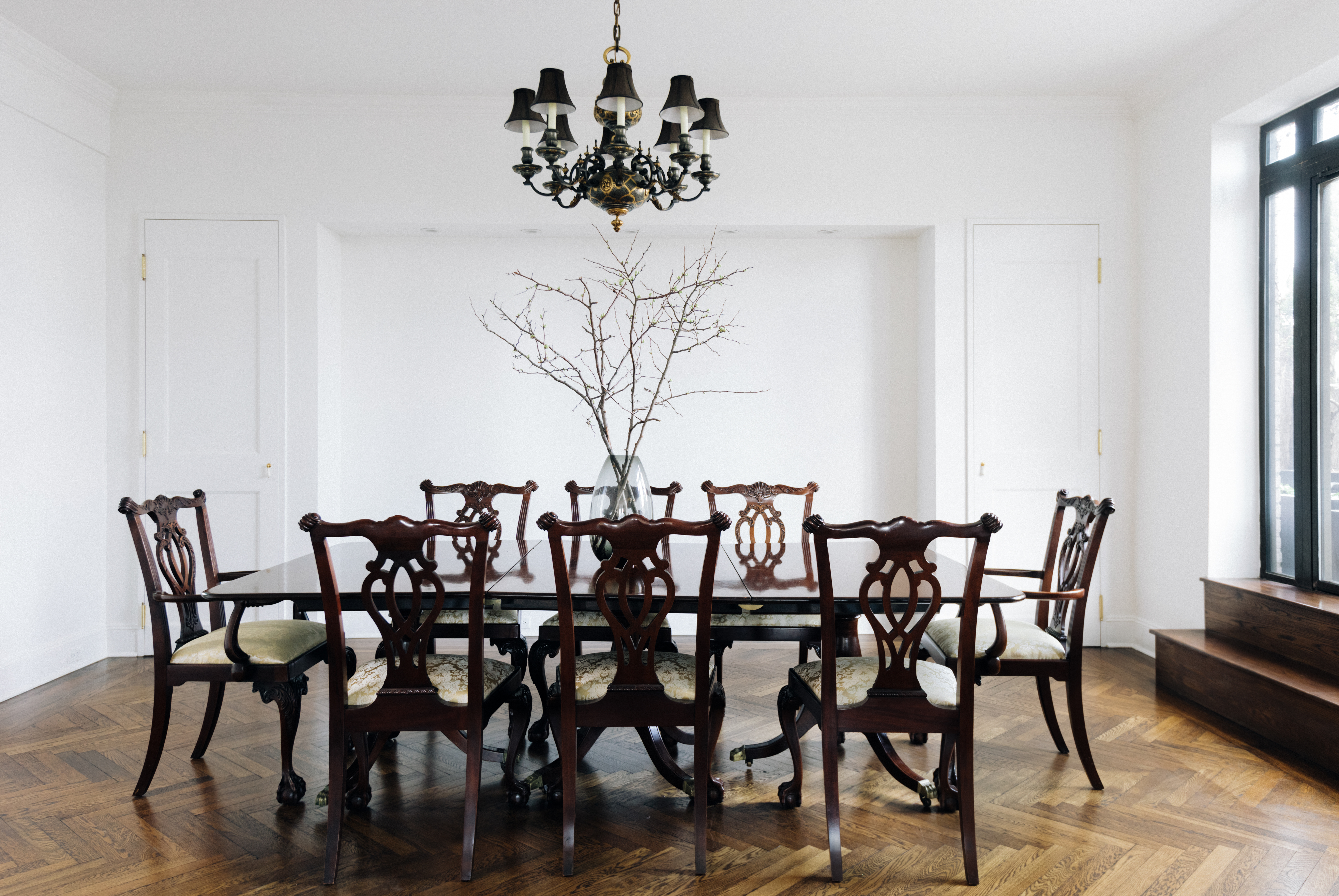 1070 Park Avenue, Unit PHE Manhattan, NY 10128 - Photo 5 of 14 a view of a dining room with furniture and wooden floor