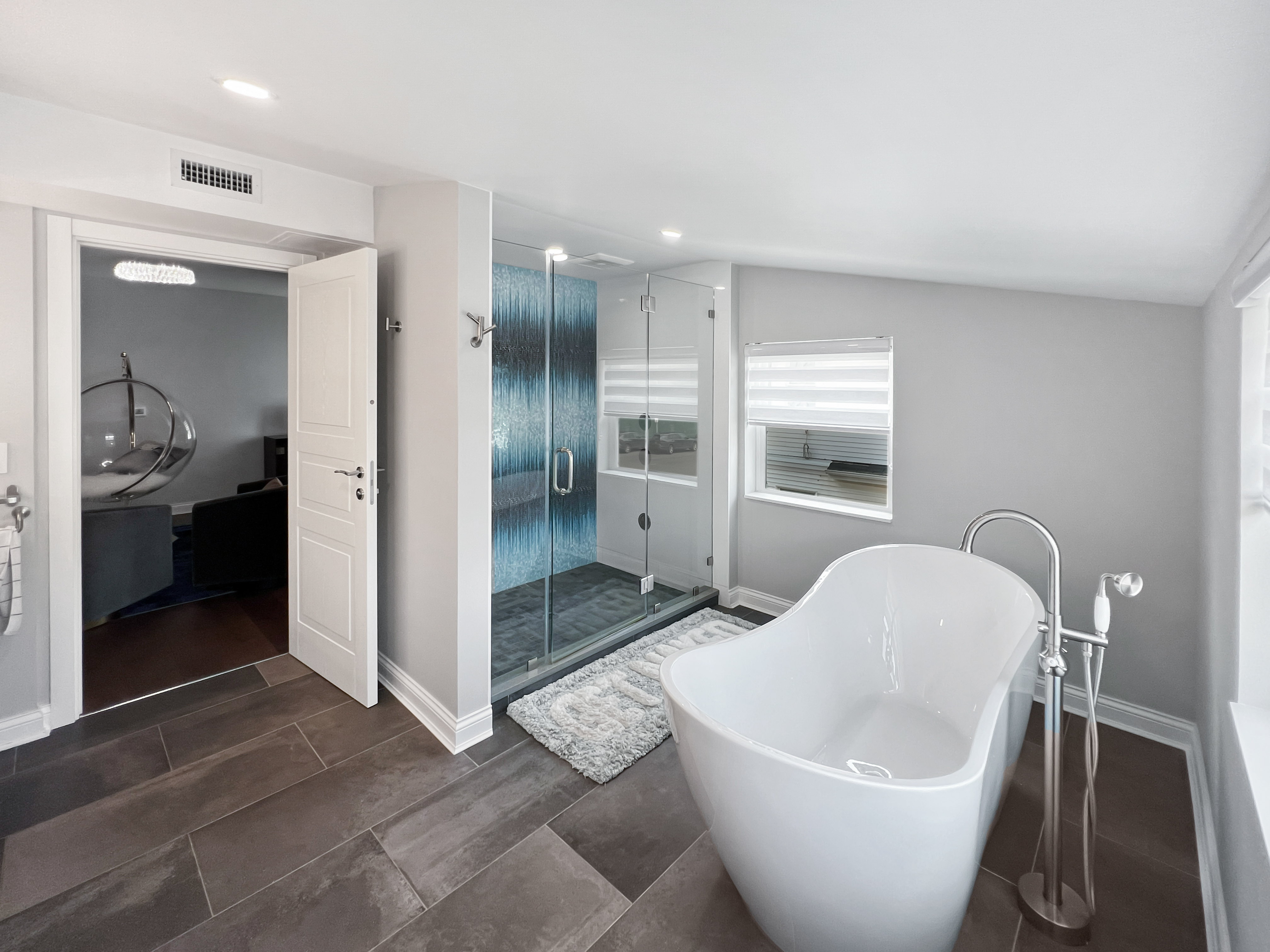 5021 Surf Avenue Brooklyn, NY 11224 - Photo 14 of 32 a spacious bathroom with a bathtub and a shower