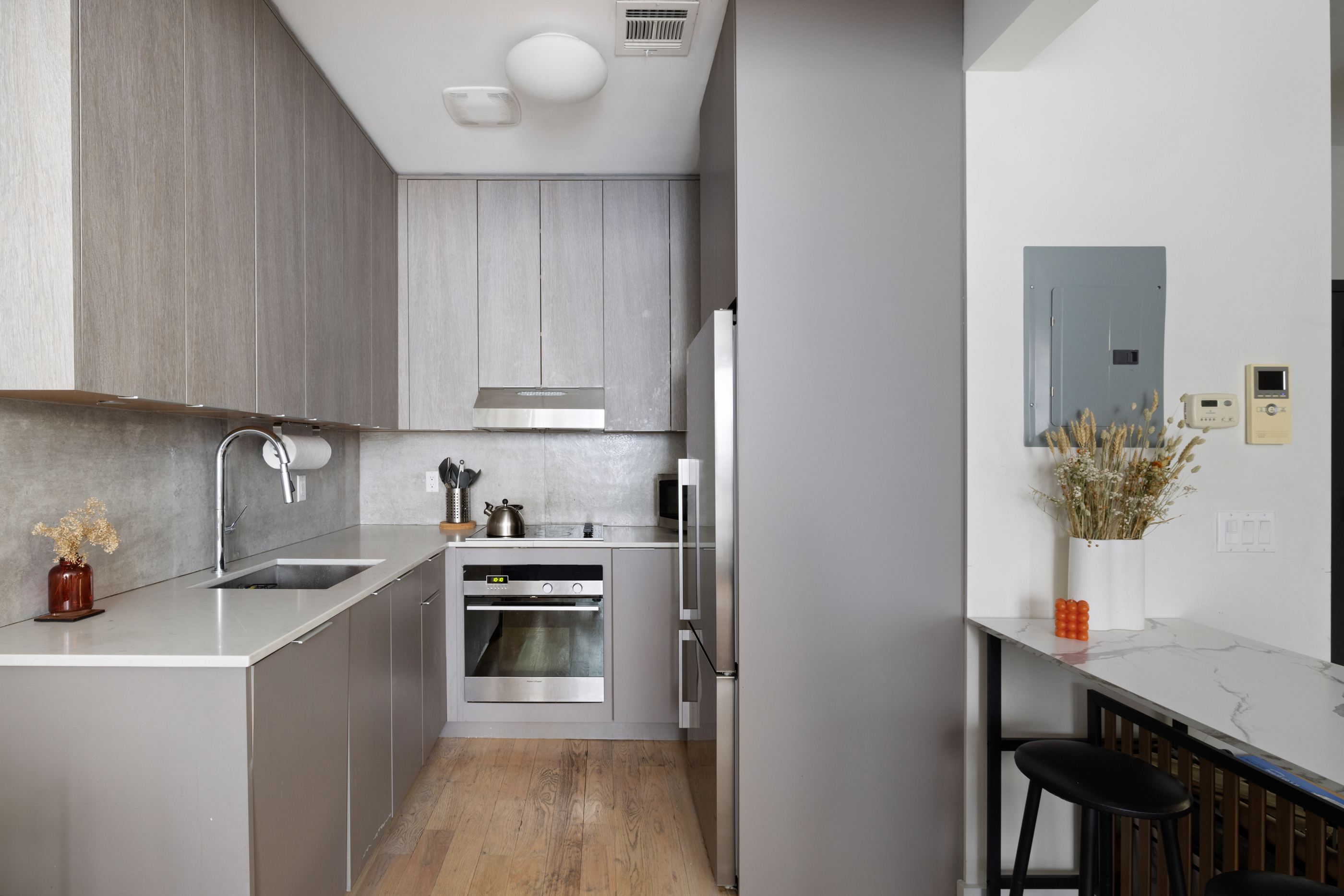 328 Central Avenue, Unit 2A Brooklyn, NY 11221 - Photo 3 of 7 a kitchen with stainless steel appliances a sink a stove a refrigerator and cabinets