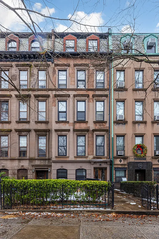 258 Clinton Avenue, Unit 1F Brooklyn, NY 11205 - Photo 5 of 6 a front view of a building with lot of windows