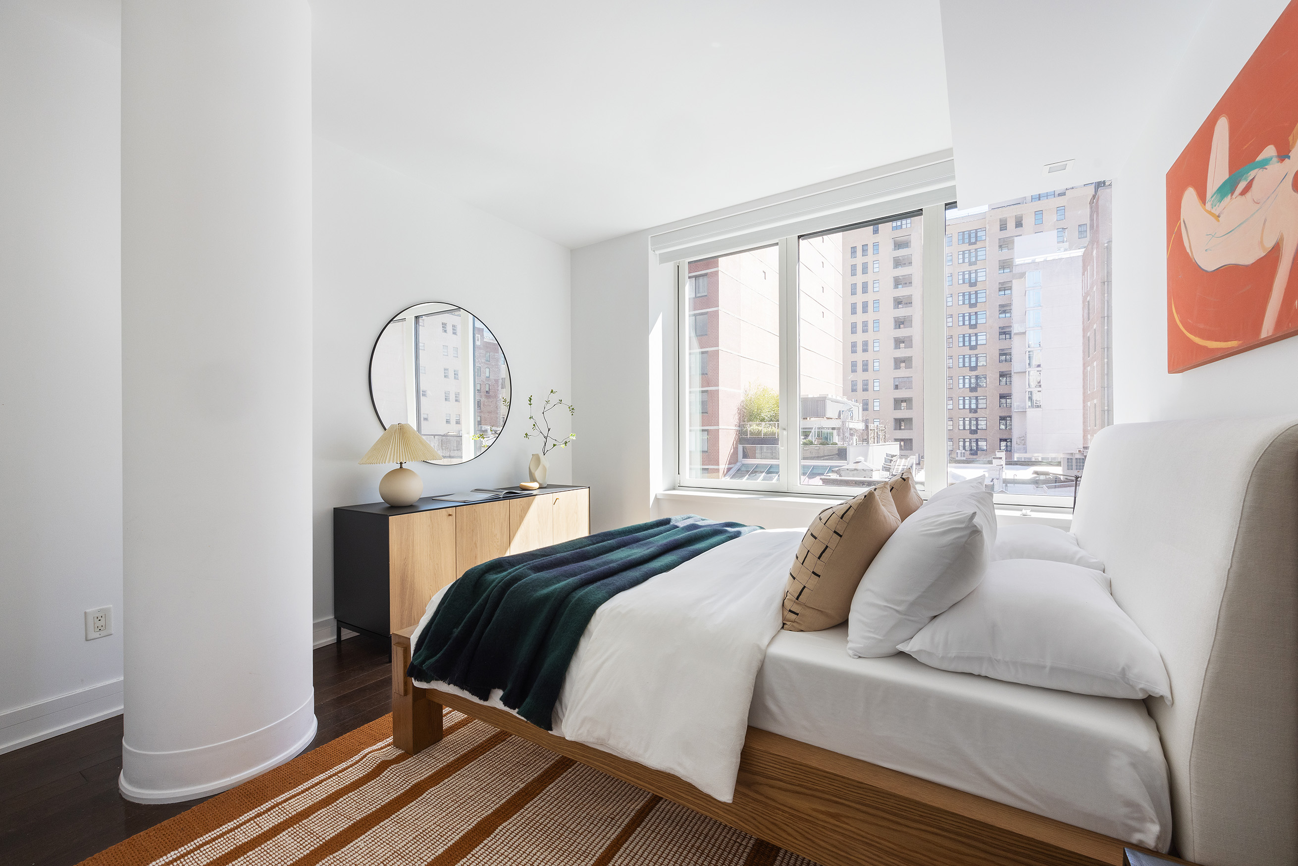 5 Franklin Place, Unit 9D Manhattan, NY 10013 - Photo 11 of 20 a bed sitting in a bedroom next to a window