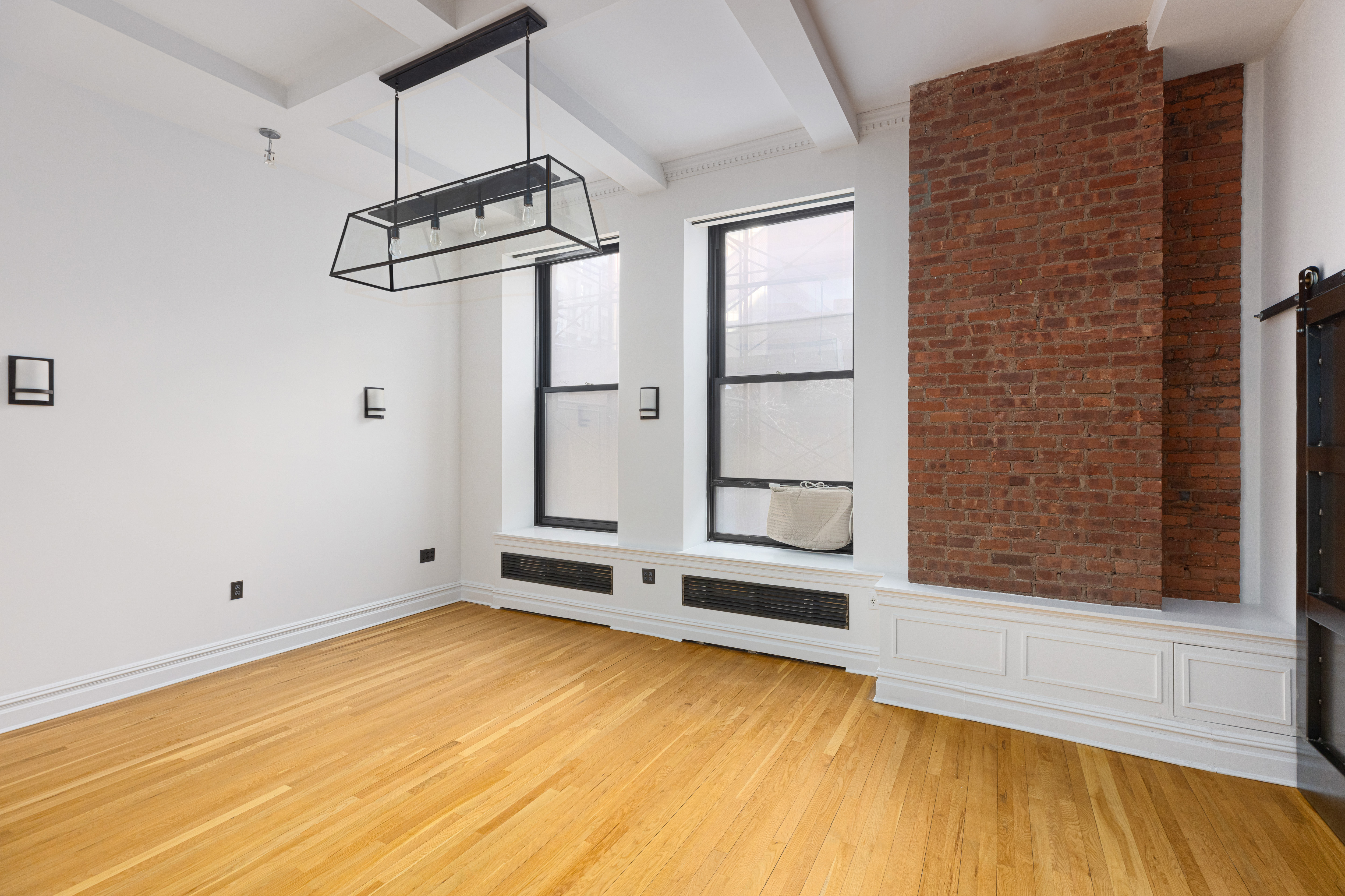 250 Mercer Street, Unit B203 Manhattan, NY 10012 - Photo 9 of 19 a view of room with hardwood floor