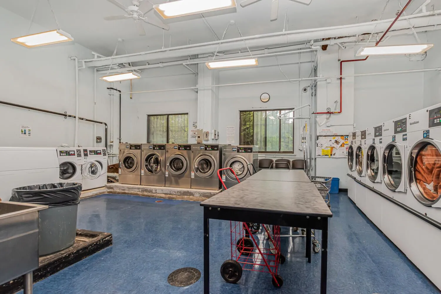 a view of a patio with table and chairs with wooden floor and fence